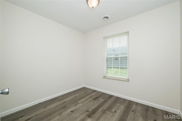 1331 Belrue Ave, Saint Louis, MO 63133 - empty room featuring baseboards and wood finished floors