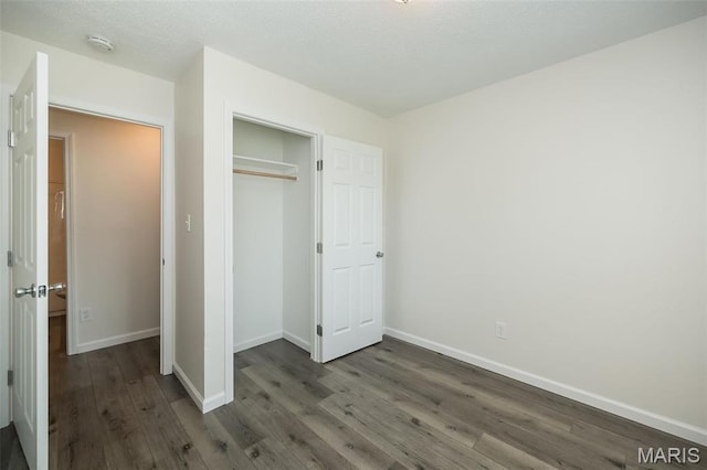 1331 Belrue Ave, Saint Louis, MO 63133 - unfurnished bedroom featuring wood finished floors, baseboards, and a closet