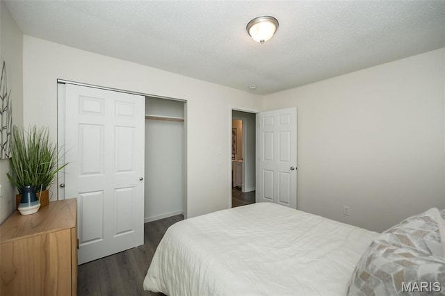 1331 Belrue Ave, Saint Louis, MO 63133 - bedroom with a closet, dark wood-style flooring, and baseboards