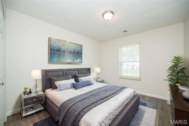 1331 Belrue Ave, Saint Louis, MO 63133 - bedroom featuring baseboards and wood finished floors