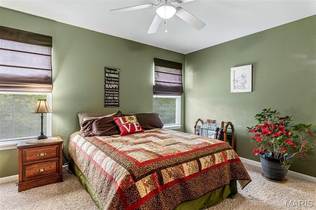 8007 Engleford Rd, Dittmer, MO 63023 - carpeted bedroom with multiple windows, baseboards, and ceiling fan