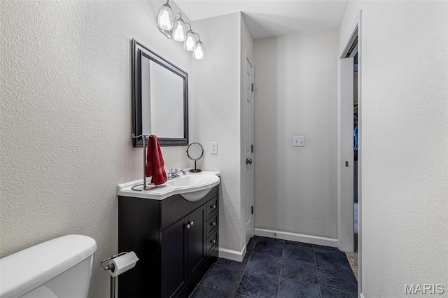 8007 Engleford Rd, Dittmer, MO 63023 - bathroom featuring vanity, toilet, and baseboards