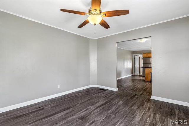314 S Carleton St, Farmington, MO 63640 - unfurnished room featuring dark wood-style flooring, baseboards, a ceiling fan, and ornamental molding