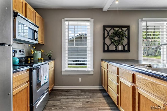 314 S Carleton St, Farmington, MO 63640 - kitchen featuring appliances with stainless steel finishes, a sink, dark countertops, and dark wood finished floors