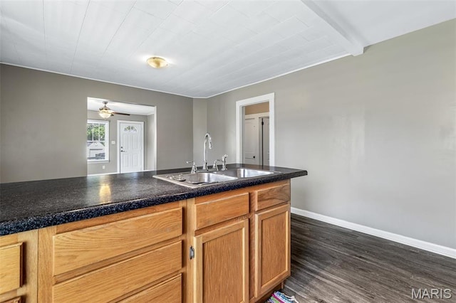 314 S Carleton St, Farmington, MO 63640 - kitchen featuring a sink, dark wood-style flooring, baseboards, dark countertops, and beam ceiling