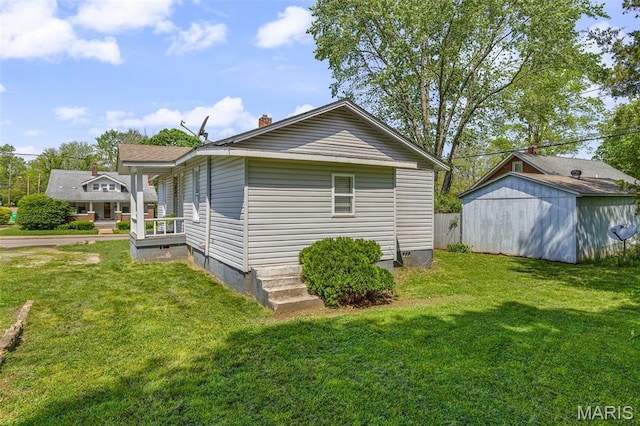 314 S Carleton St, Farmington, MO 63640 - view of side of property with a yard, crawl space, and an outbuilding