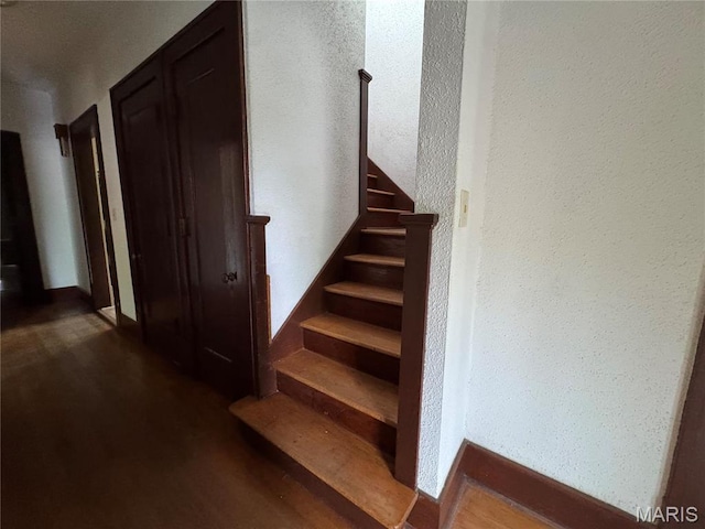 813 Main St, Poplar Bluff, MO 63901 - stairway featuring wood finished floors and baseboards