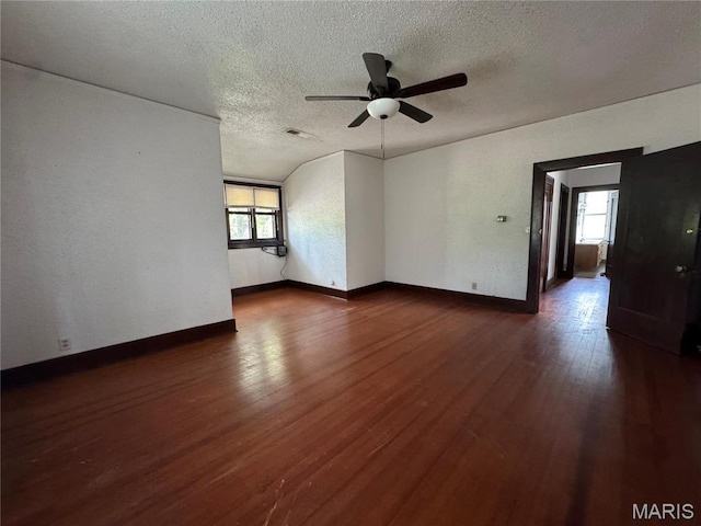 813 Main St, Poplar Bluff, MO 63901 - unfurnished room with plenty of natural light, a ceiling fan, a textured ceiling, dark wood-style floors, and baseboards