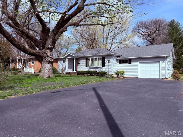 1808 N 15th St, Swansea, IL 62226 - view of front of home featuring a garage, driveway, a front lawn, and a shingled roof