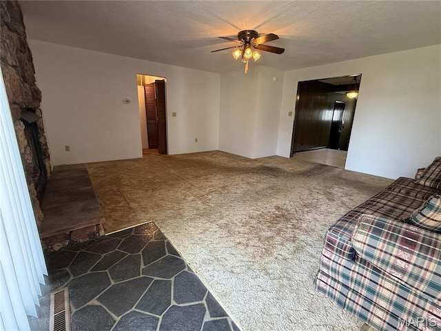 1808 N 15th St, Swansea, IL 62226 - unfurnished living room featuring carpet flooring, ceiling fan, and a textured ceiling