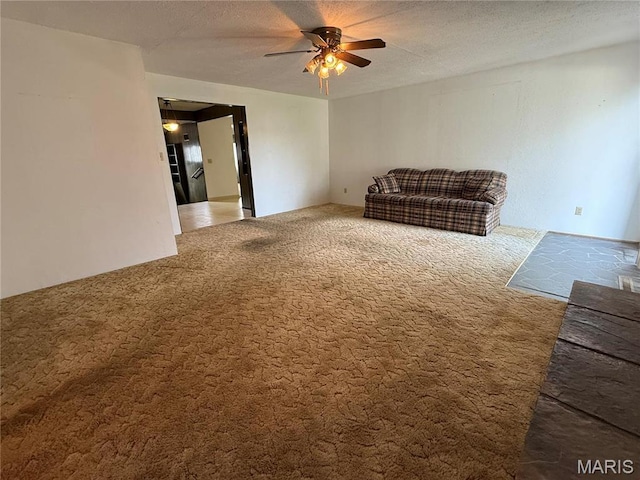 1808 N 15th St, Swansea, IL 62226 - living room featuring a ceiling fan, carpet flooring, and a textured ceiling