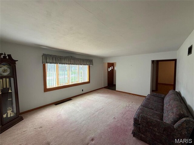 1808 N 15th St, Swansea, IL 62226 - unfurnished living room with carpet floors and baseboards