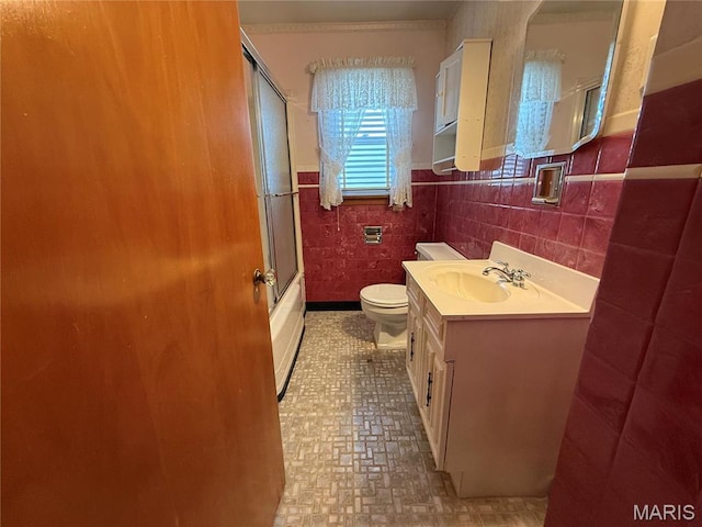 1808 N 15th St, Swansea, IL 62226 - full bathroom featuring toilet, vanity, a wainscoted wall, shower / bath combination with glass door, and tile walls