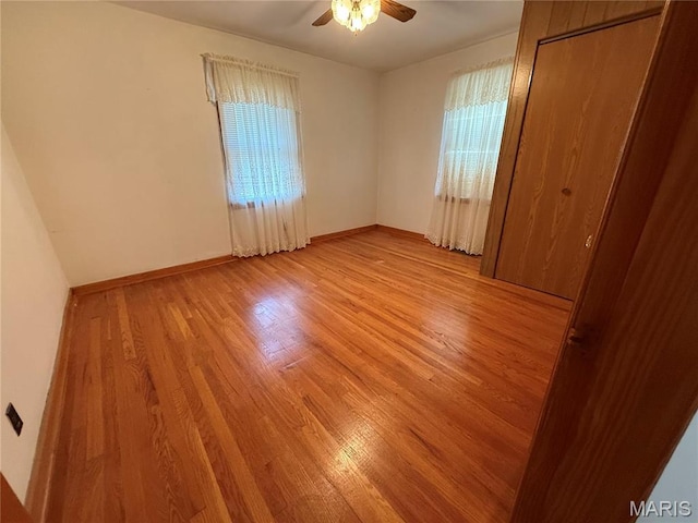 1808 N 15th St, Swansea, IL 62226 - unfurnished bedroom with light wood finished floors, baseboards, and a ceiling fan