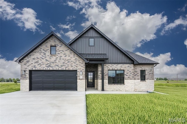 837 Bushwood Way, Ofallon, IL 62269 - view of front of home with board and batten siding, concrete driveway, a front yard, and brick siding