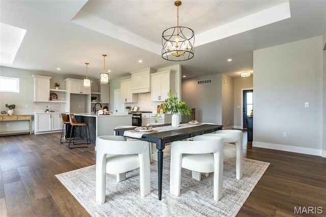 837 Bushwood Way, Ofallon, IL 62269 - dining room with recessed lighting, dark wood finished floors, a chandelier, baseboards, and a raised ceiling