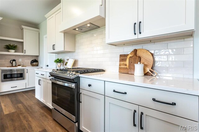 837 Bushwood Way, Ofallon, IL 62269 - kitchen featuring stainless steel gas stove, custom range hood, open shelves, backsplash, and dark wood finished floors