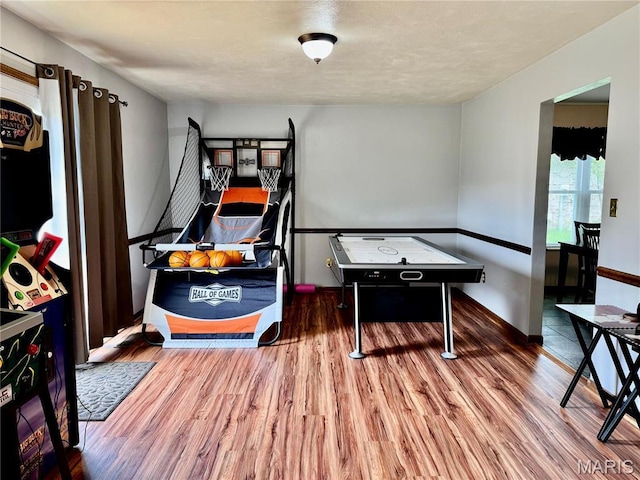 1725 Spruce Hill Dr, Belleville, IL 62221 - playroom with wood finished floors and baseboards