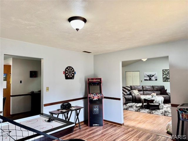 1725 Spruce Hill Dr, Belleville, IL 62221 - dining room with wood finished floors, baseboards, and a textured ceiling