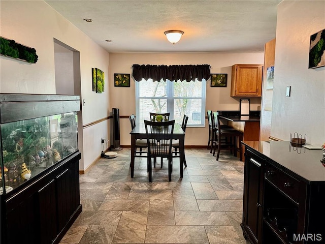 1725 Spruce Hill Dr, Belleville, IL 62221 - dining space featuring baseboards and stone finish flooring