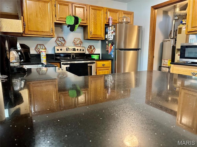 1725 Spruce Hill Dr, Belleville, IL 62221 - kitchen with stainless steel appliances, gas water heater, and brown cabinets