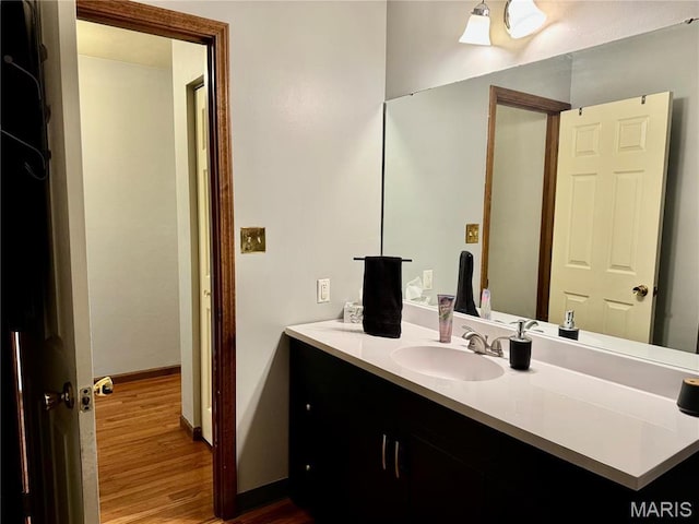 1725 Spruce Hill Dr, Belleville, IL 62221 - bathroom featuring wood finished floors, vanity, and baseboards