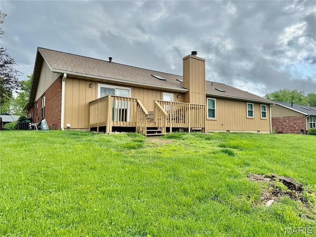 1725 Spruce Hill Dr, Belleville, IL 62221 - back of house with a chimney, a wooden deck, a lawn, a shingled roof, and brick siding