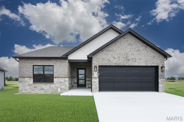 view of front of property featuring an attached garage, concrete driveway, a front yard, stone siding, and brick siding