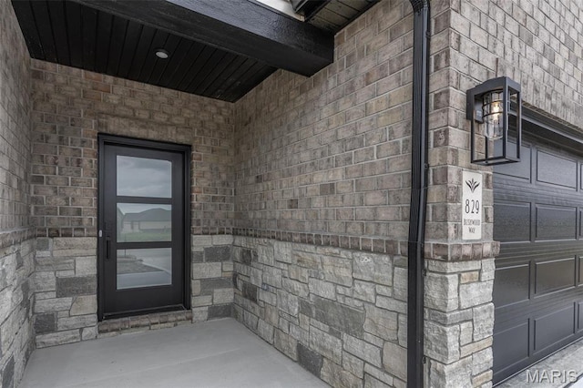 entrance to property with stone siding