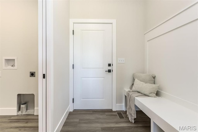 mudroom with dark wood finished floors and baseboards