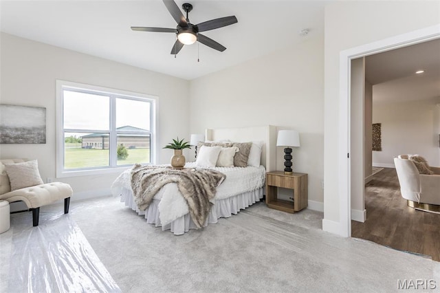 bedroom with baseboards, a ceiling fan, and carpet flooring