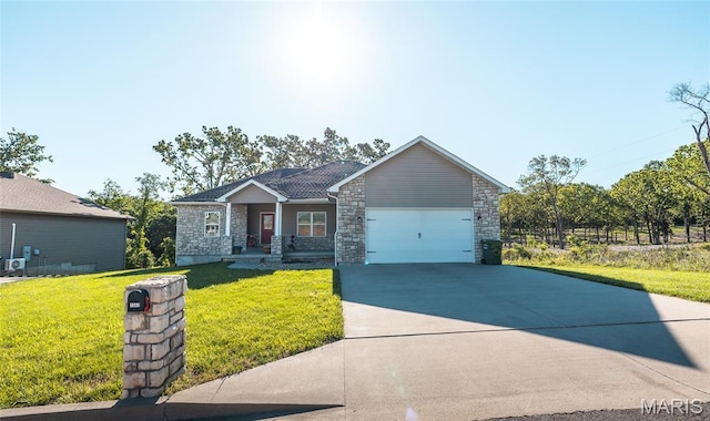 1347 Thomas Dr, Rolla, MO 65401 - single story home featuring a garage, concrete driveway, stone siding, and a front yard
