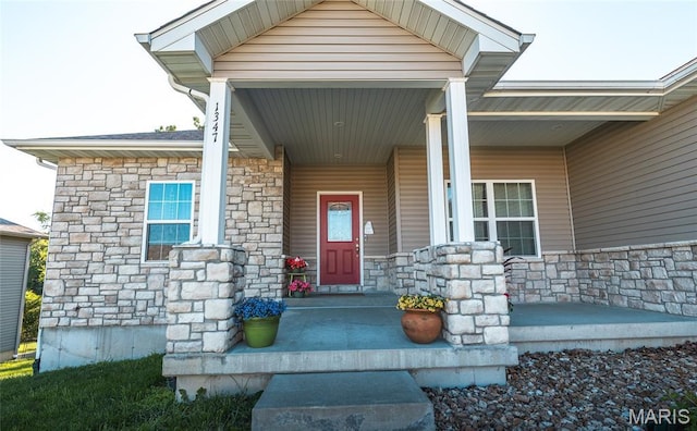 1347 Thomas Dr, Rolla, MO 65401 - doorway to property featuring stone siding and a porch