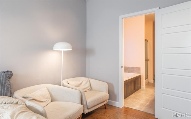 1347 Thomas Dr, Rolla, MO 65401 - living area with light wood-style flooring and baseboards