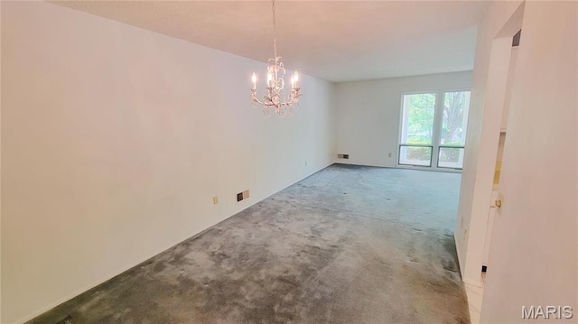 5489 Limerick Dr, Saint Louis, MO 63128 - carpeted empty room with a chandelier