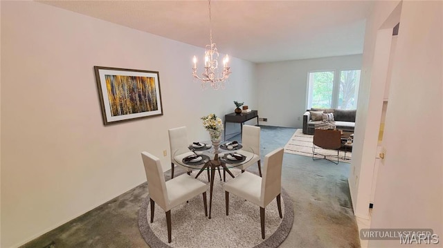 5489 Limerick Dr, Saint Louis, MO 63128 - dining space featuring dark colored carpet and a chandelier