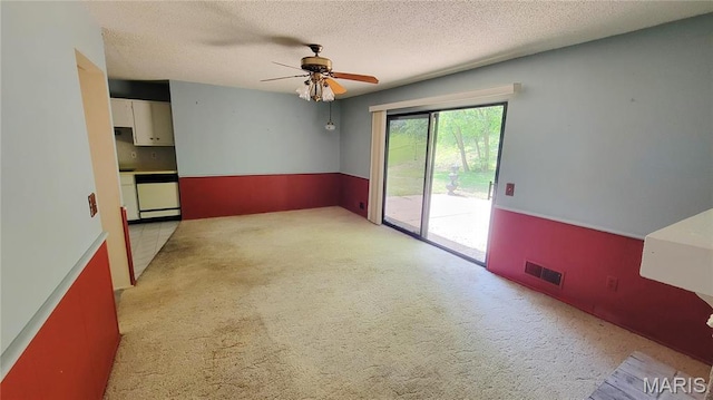 5489 Limerick Dr, Saint Louis, MO 63128 - empty room featuring light colored carpet, ceiling fan, and a textured ceiling