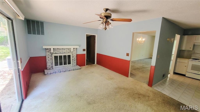 5489 Limerick Dr, Saint Louis, MO 63128 - unfurnished living room with a chandelier, ceiling fan, a fireplace, and carpet floors