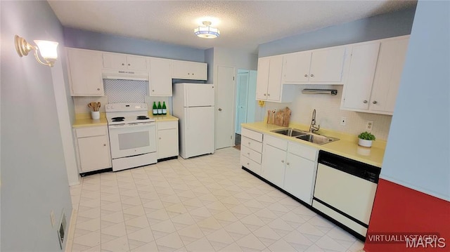 5489 Limerick Dr, Saint Louis, MO 63128 - kitchen with white appliances, a sink, under cabinet range hood, light countertops, and tasteful backsplash
