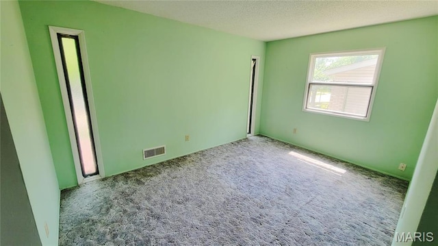 5489 Limerick Dr, Saint Louis, MO 63128 - unfurnished bedroom featuring carpet flooring and a textured ceiling