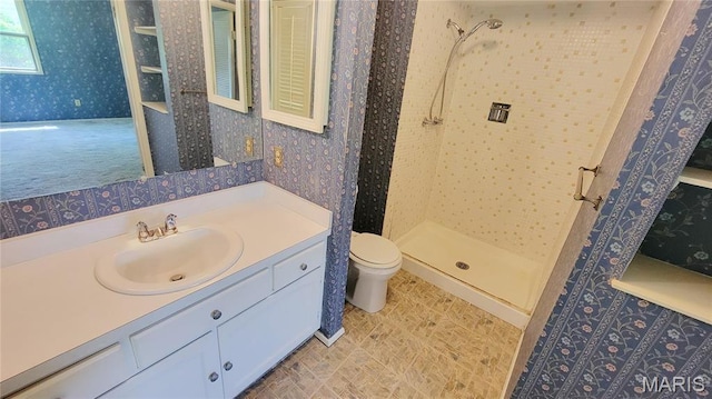 5489 Limerick Dr, Saint Louis, MO 63128 - bathroom featuring wallpapered walls, a tile shower, toilet, and vanity