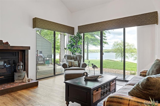 45 S Lionshead Dr, Innsbrook, MO 63390 - living room with a water view, wood finished floors, and a towering ceiling