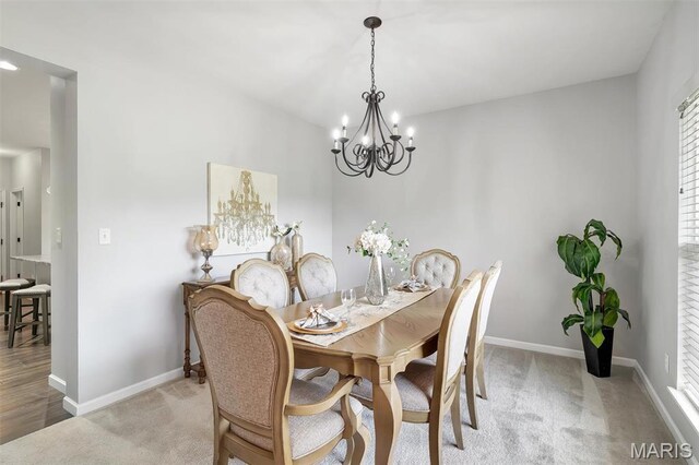 153 Stella Cherry Way, Wildwood, MO 63040 - dining area with a chandelier, baseboards, light colored carpet, and plenty of natural light