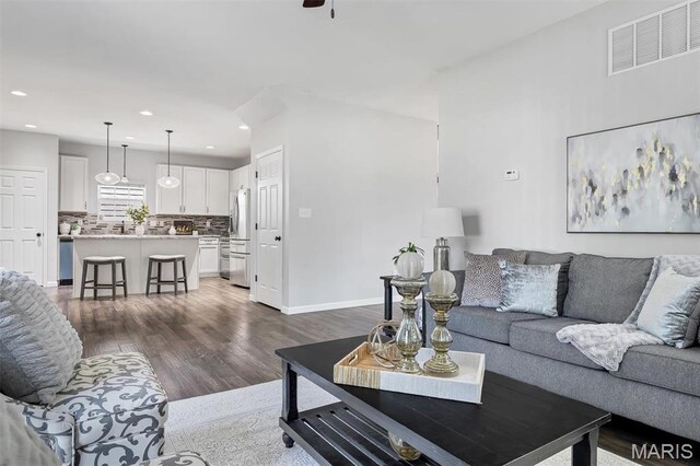 153 Stella Cherry Way, Wildwood, MO 63040 - living area with dark wood finished floors, recessed lighting, baseboards, and ceiling fan