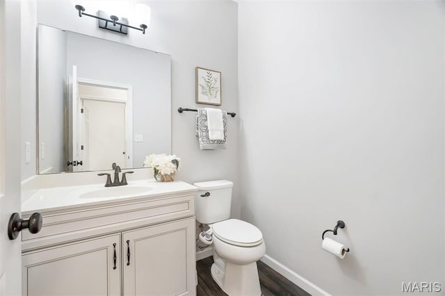 153 Stella Cherry Way, Wildwood, MO 63040 - bathroom with toilet, vanity, wood finished floors, and baseboards