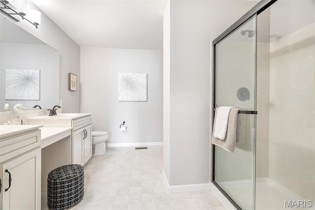 153 Stella Cherry Way, Wildwood, MO 63040 - bathroom featuring double vanity, a stall shower, baseboards, and toilet
