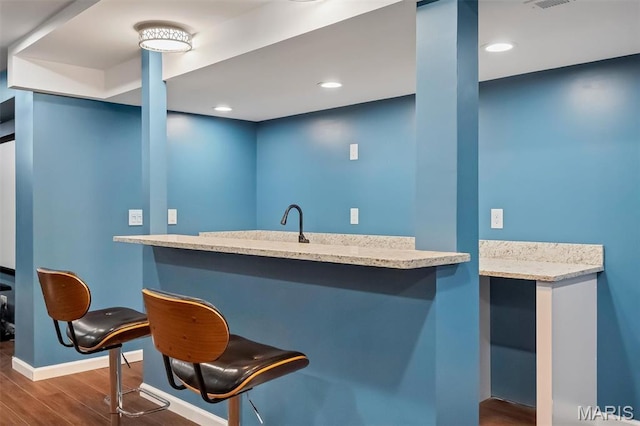 153 Stella Cherry Way, Wildwood, MO 63040 - indoor wet bar with wood finished floors, baseboards, and recessed lighting