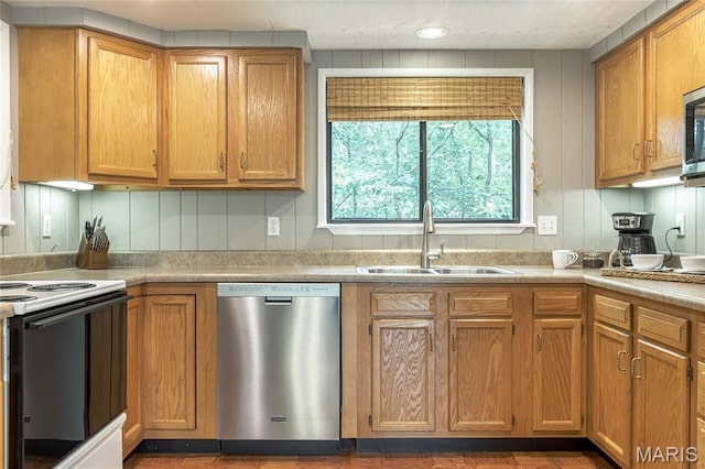 1235 Powderhorn Dr, Innsbrook, MO 63390 - kitchen with appliances with stainless steel finishes, a sink, light countertops, and wood finished floors