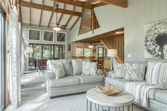 1235 Powderhorn Dr, Innsbrook, MO 63390 - carpeted living area featuring ceiling fan, high vaulted ceiling, beam ceiling, and wooden walls