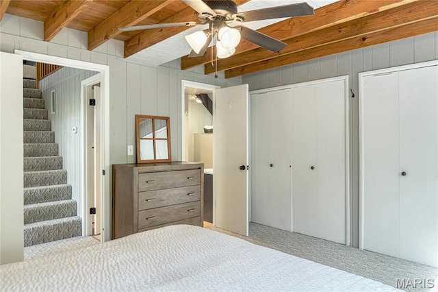 1235 Powderhorn Dr, Innsbrook, MO 63390 - bedroom featuring beamed ceiling, two closets, and a ceiling fan